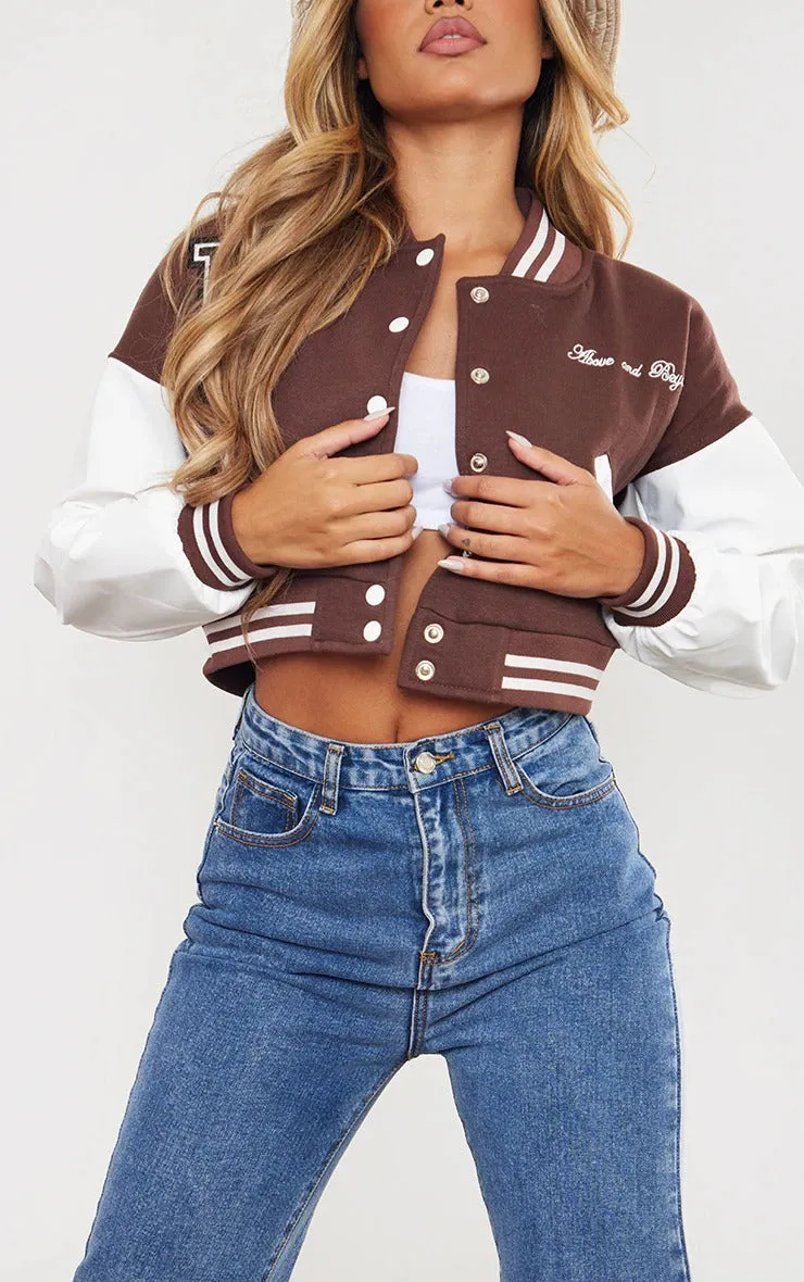 CHOCOLATE VARSITY GRAPHIC FAUX LEATHER SLEEVE BOMBER JACKET